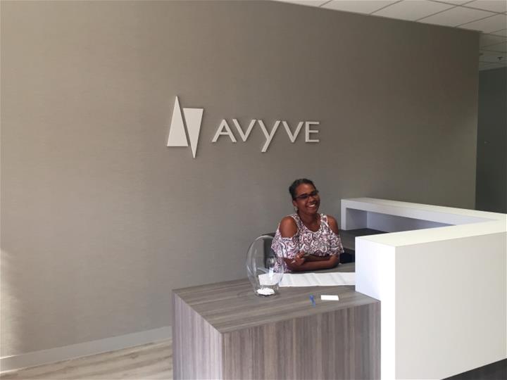 Avyve front desk sign